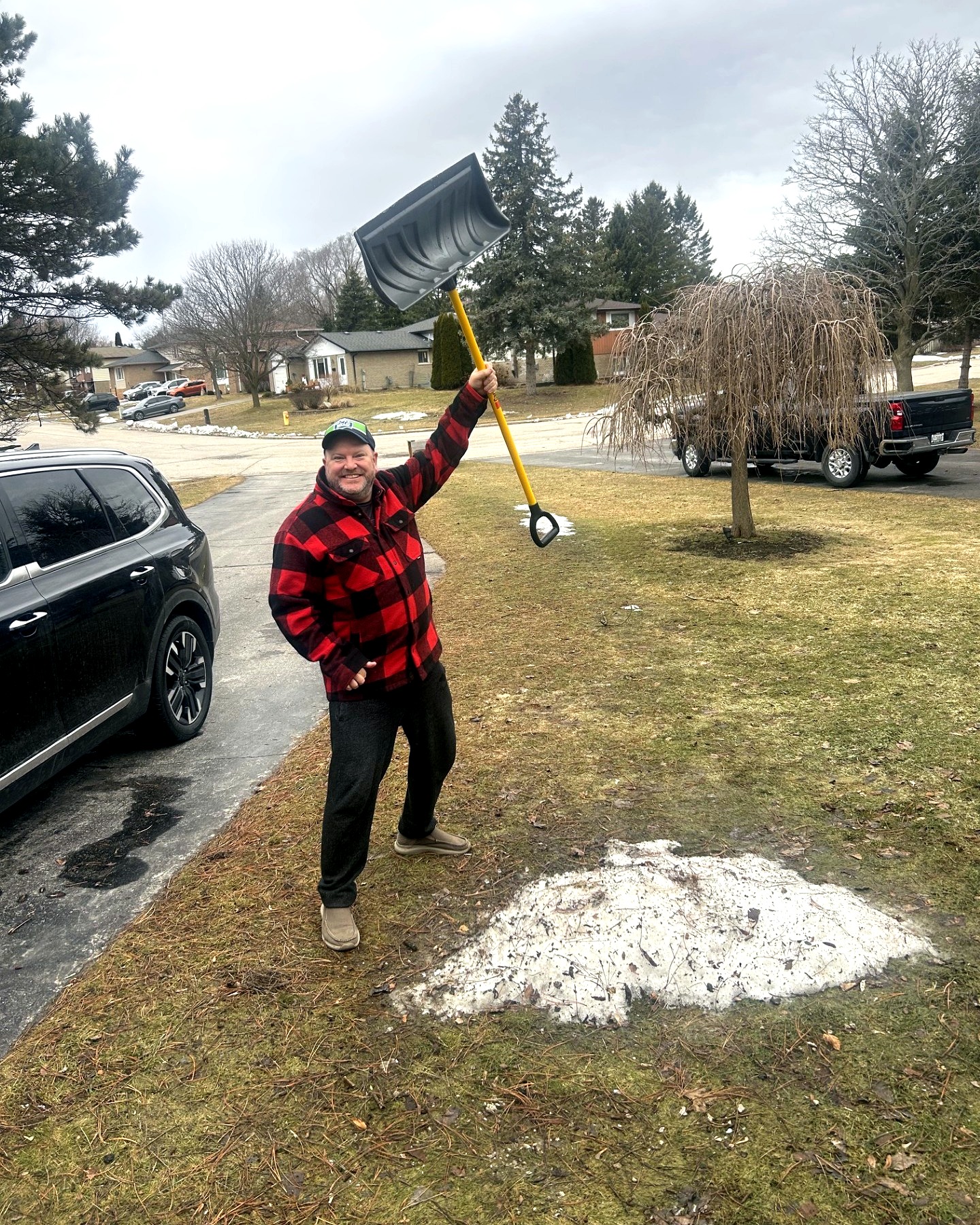 Caleb Carisse shoveling snow in his neighbourhood